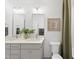 Modern bathroom with double vanity, shower, and green curtain at 3401 Makers Cir, Raleigh, NC 27612