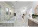 Modern bathroom with soaking tub, glass shower, dual vanities, and decorative mirrors at 3401 Makers Cir, Raleigh, NC 27612