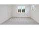 Empty bedroom with carpet flooring and multiple windows at 3401 Makers Cir, Raleigh, NC 27612