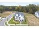 Modern two-story home with a gray roof and white siding in a new development at 3401 Makers Cir, Raleigh, NC 27612