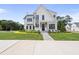 Inviting white two-story home with black accents, lush lawn, and welcoming entryway at 3401 Makers Cir, Raleigh, NC 27612