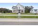 Modern two-story white farmhouse with black trim and a large front yard at 3401 Makers Cir, Raleigh, NC 27612