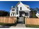 Inviting front yard with a wooden picket fence and a decorative metal gate at 3401 Makers Cir, Raleigh, NC 27612