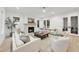 Living room featuring a fireplace, plush seating, and access to a patio at 3401 Makers Cir, Raleigh, NC 27612