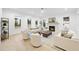 Bright living room with a fireplace, large windows, and stylish furniture at 3401 Makers Cir, Raleigh, NC 27612