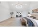 Spacious main bedroom with vaulted ceiling, hardwood floors, and large windows at 3401 Makers Cir, Raleigh, NC 27612