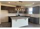 Modern kitchen with stainless steel appliances and an island at 323 Chestnut Oak Ln, Lillington, NC 27546