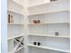 Bright white pantry with ample shelving for storage at 204 Cardinal Ct, Oxford, NC 27565