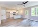 Open kitchen with white cabinets, granite countertops, and island at 204 Cardinal Ct, Oxford, NC 27565