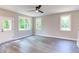 Spacious living room with hardwood floors and multiple windows at 204 Cardinal Ct, Oxford, NC 27565