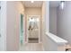Upstairs hallway leading to bedrooms and a bathroom, featuring neutral walls and carpet at 204 Cardinal Ct, Oxford, NC 27565