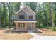 Two-story house with light brown siding and dark brown accents at 204 Cardinal Ct, Oxford, NC 27565