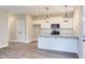 Modern kitchen with white cabinets, granite countertops and stainless steel appliances at 204 Cardinal Ct, Oxford, NC 27565