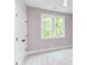 Bright bedroom with neutral walls, carpet, and a large window at 204 Cardinal Ct, Oxford, NC 27565