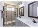 Modern bathroom with double vanity, frameless shower, and neutral tones at 204 Cardinal Ct, Oxford, NC 27565