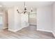 Bright dining room with chandelier and hardwood floors at 204 Cardinal Ct, Oxford, NC 27565