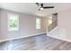 Bright living room featuring hardwood floors and a ceiling fan at 204 Cardinal Ct, Oxford, NC 27565