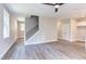 Spacious living room with hardwood floors, neutral walls, and a view of the staircase at 204 Cardinal Ct, Oxford, NC 27565