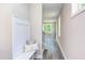 Hallway with a built-in bench and view into the living room at 204 Cardinal Ct, Oxford, NC 27565