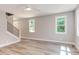 Bright living room features hardwood floors, neutral walls, and large windows at 206 Cardinal Ct, Oxford, NC 27565