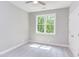 Bright bedroom with window, ceiling fan and grey carpet at 206 Cardinal Ct, Oxford, NC 27565