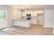 Modern kitchen with white cabinets, granite countertops, and stainless steel appliances at 206 Cardinal Ct, Oxford, NC 27565