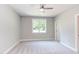 Bright bedroom with carpeted floor, large window, and ceiling fan at 206 Cardinal Ct, Oxford, NC 27565