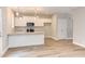 Modern kitchen with white cabinets, granite countertops, and stainless steel appliances at 206 Cardinal Ct, Oxford, NC 27565