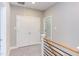 Upstairs hallway with double doors and wood railing at 206 Cardinal Ct, Oxford, NC 27565