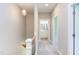 Upstairs hallway with carpet, access to bathroom and bedrooms at 206 Cardinal Ct, Oxford, NC 27565