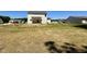 Large backyard with new home and surrounding houses at 295 Earnest Way, Kenly, NC 27542