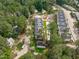 Aerial view of townhomes nestled in a wooded neighborhood at 5049 Lundy Dr # 101, Raleigh, NC 27606