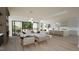 Open living room showcasing a sectional sofa, fireplace, and access to a backyard patio at 2332 Windy Woods Dr, Raleigh, NC 27607