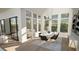 Bright dining room with a large table and access to the patio at 2332 Windy Woods Dr, Raleigh, NC 27607
