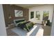 Spacious bedroom with a large bed, ample natural light, and a decorative wall at 2332 Windy Woods Dr, Raleigh, NC 27607