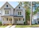 Two-story modern farmhouse with gray siding at 5053 Lundy Dr # 101, Raleigh, NC 27606