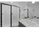 Modern bathroom with white subway tiles, a glass shower, and a vanity with sink at 5053 Lundy Dr # 101, Raleigh, NC 27606