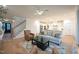 Open living room showcasing a cozy seating area and a view into the kitchen at 143 Sallyport Ct, Raleigh, NC 27603