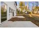 Small concrete patio in backyard with access from sliding glass door at 329 Roxboro St, Haw River, NC 27258