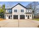 Modern farmhouse style duplex with two-car garages at 329 Roxboro St, Haw River, NC 27258