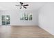 Spacious living room with hardwood floors and sliding glass door to patio at 331 Roxboro St, Haw River, NC 27258