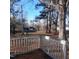 Spacious backyard view from a wooden deck with play area at 1852 Nc 62 Hwy N, Burlington, NC 27217
