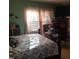Bedroom featuring a wooden bedframe, recliner, and a cozy atmosphere at 1852 Nc 62 Hwy N, Burlington, NC 27217