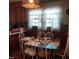 Kitchen dining area with a glass-top table and white chairs at 1852 Nc 62 Hwy N, Burlington, NC 27217