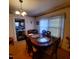Dining room with an elegant wooden table, stylish chairs, and soft lighting at 1852 Nc 62 Hwy N, Burlington, NC 27217