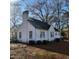 Exterior view of a white single-story home with visible AC unit at 1852 Nc 62 Hwy N, Burlington, NC 27217
