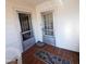 Front porch featuring a double door entry and wicker chair at 1852 Nc 62 Hwy N, Burlington, NC 27217