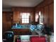 Compact kitchen with white countertops and ample cabinetry at 1852 Nc 62 Hwy N, Burlington, NC 27217