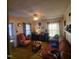 Living room with plush seating, charming decor, and ample natural light at 1852 Nc 62 Hwy N, Burlington, NC 27217