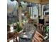 Bright sunroom filled with plants and wicker furniture at 1852 Nc 62 Hwy N, Burlington, NC 27217